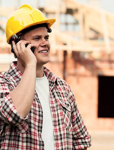 An installer talking on the phone