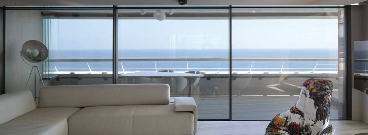 aluminium slimline sliding doors with panoramic views of the ocean